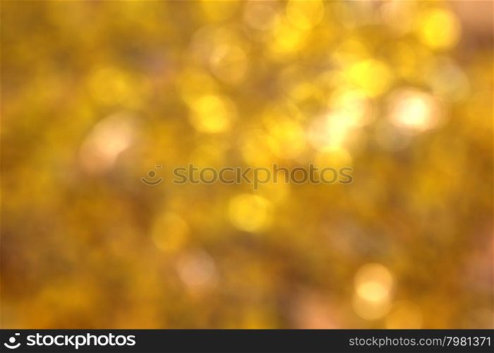 Abstract circular natural golden light bokeh background