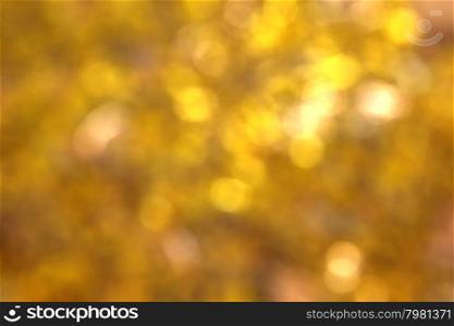 Abstract circular natural golden light bokeh background