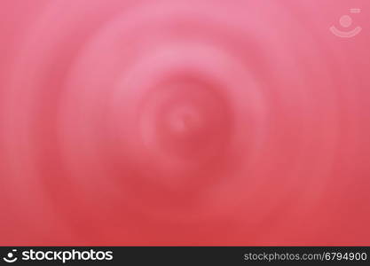 Abstract circular pink and red radial background