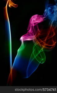 abstract colored smoke in a black background