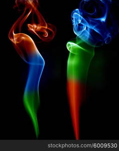 abstract colored smoke in a black background