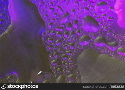 Abstract colorful backdrop or background with water drops on colorful surface. Abstract background concept