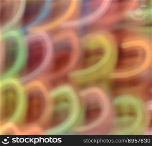 Abstract colorful neon light curves motion background. Long shut. Abstract colorful background of neon lights on street with long exposure shot with motion blur effect