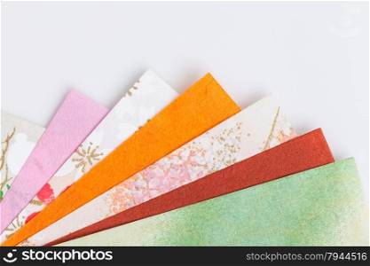 Abstract colorful origami paper pattern texture stacked layer respective, on white background