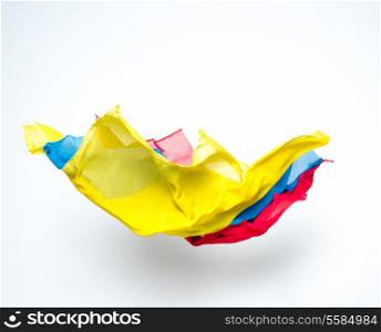 abstract colorful pieces of fabric flying, studio shot, design element