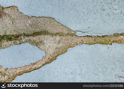 Abstract damaged grey wall with chipped paint on the surface