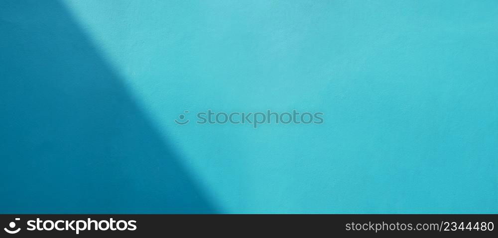Abstract daytime shadows on blue concrete wall texture background