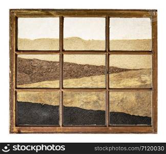 abstract desert landscape created with handmade sheets of rough paper as seen through a vintage sash window