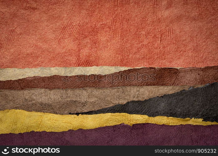 abstract desert or badlands landscape created with sheets of textured colorful handmade paper
