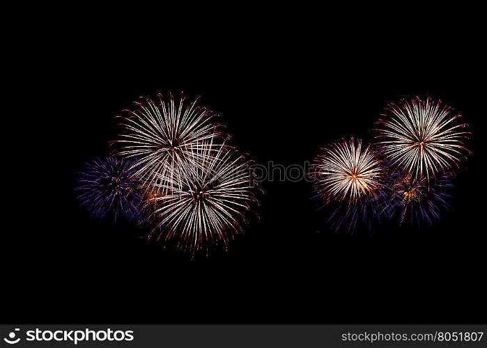 abstract Fireworks light up the dark sky background