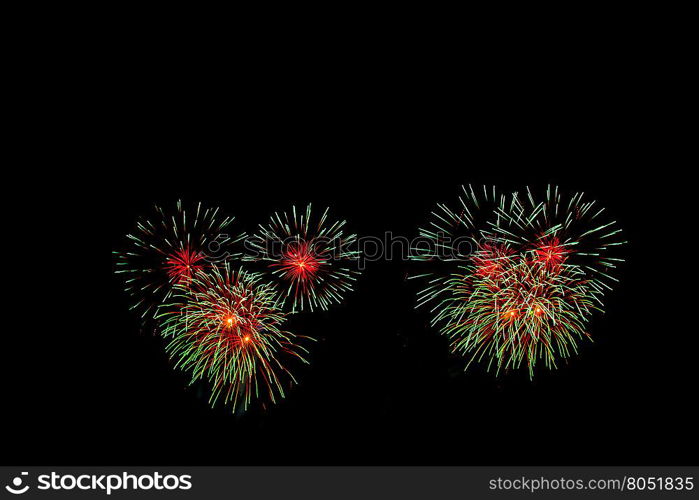 abstract Fireworks light up the dark sky background