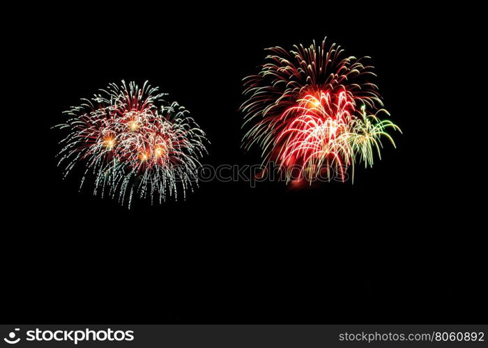 abstract Fireworks light up the dark sky background