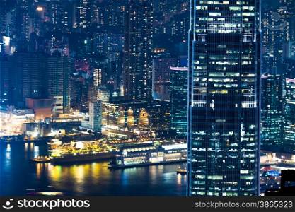 Abstract futuristic night cityscape with illuminated skyscrapers. Hong Kong aerial view panorama
