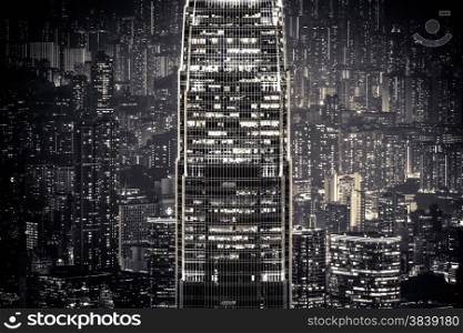 Abstract futuristic night cityscape with illuminated skyscrapers. Hong Kong black and white background