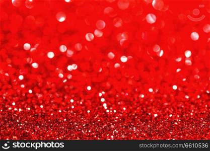 Abstract glitter bokeh holiday red background