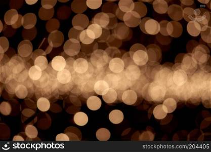 abstract golden background of christmas lights. bokeh background. golden christmas lights background