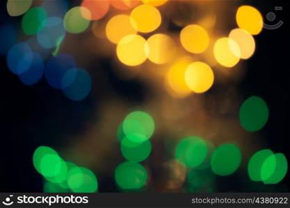 Abstract green and yellow circular bokeh background of Christmaslights