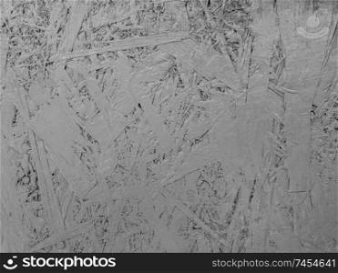 Abstract grey color painted oriented strand board. Grunge plywood texture background.