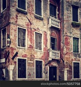 Abstract grungy old wall background, vintage building facade, traditional Italian architecture, venetian aged exterior, Venice, Italy