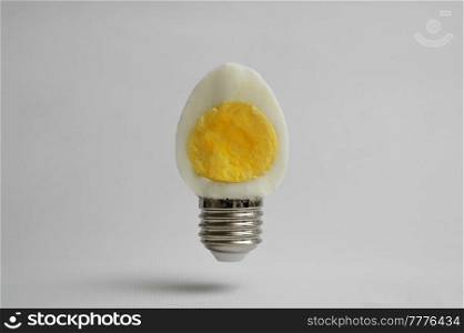 Abstract Half Hard Boiled Egg and Base Of Light Bulb
