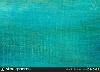 Abstract hand painted green canvas background texture.