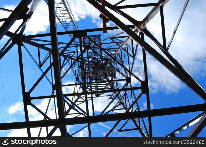 abstract high-voltage tower on blue sky background