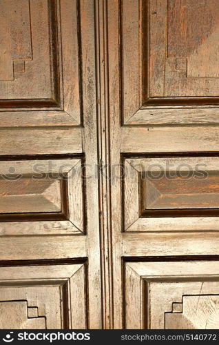 abstract house door in italy lombardy column the milano old closed nail rusty