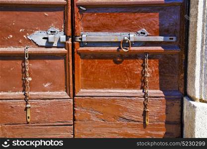abstract house door in italy lombardy column the milano old closed nail rusty