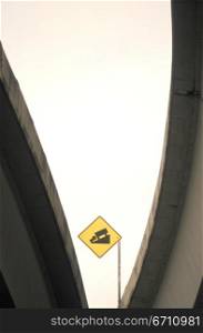 Abstract image of a bridge and a sign