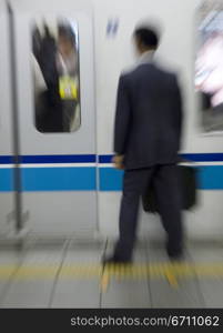 Abstract image of man waiting for train