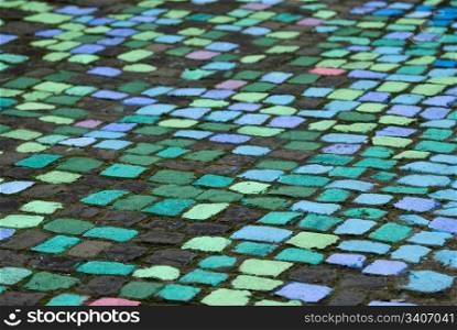 abstract image with manny cobblestones painted in manny colors