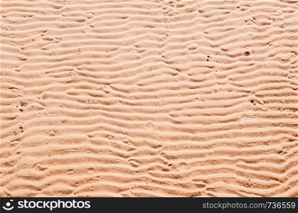 Abstract imperfect horizontal sand wave texture background warm tone colour sand beach details