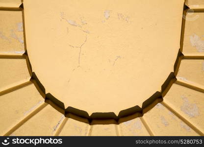 abstract in italy vinago varese the old wall and the window of a church