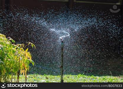 abstract irrigation of agricultural field, water sprinkler