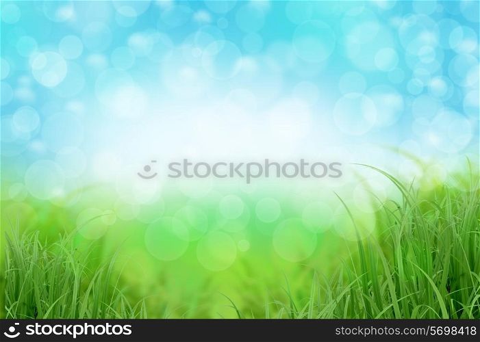 Abstract landscape background with green grass and blue sky