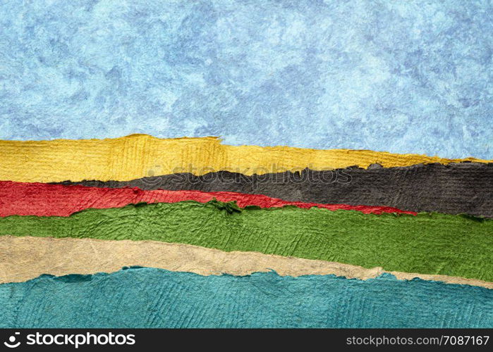 abstract landscape created with sheets of textured colorful handmade paper