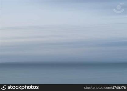 Abstract landscape image of blurred coastal sunrise
