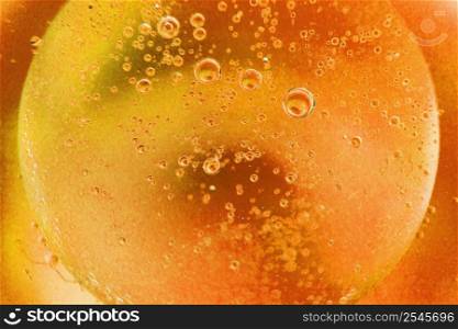 abstract light orange background with oil circles . bubbles of water close up . oil bubbles in the water macro. fiery circle bubbles background. abstract light orange background with oil circles . oil bubbles of water close up. fiery circle bubbles background