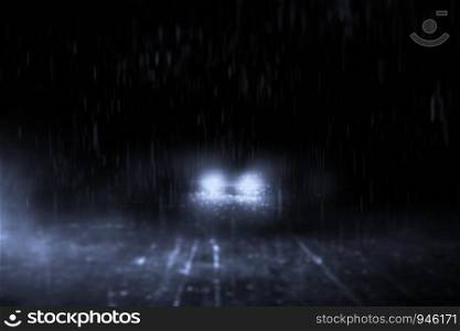 Abstract lonely streets at night, with cars running in the rain