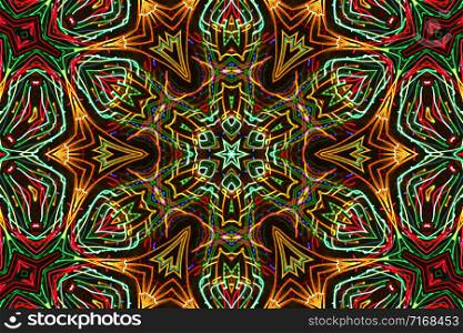 Abstract luminous pattern from colorful lines on black backgrond