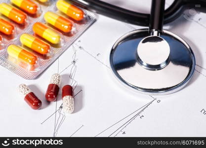 Abstract medicine backgrounds with pills, stethoscope over heart diagram