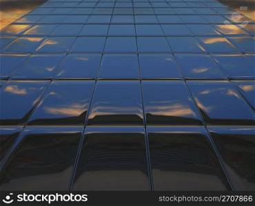 Abstract metal wall against cloudy sky