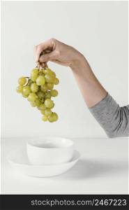 abstract minimal concept grapes hand