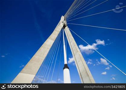 Abstract modern architecture of the Swietokrzyski suspension bridge in Warsaw, Poland