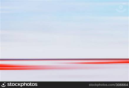 Abstract motion blurred light landscape background with horizontal red stripe and horizon line. Large space for copy text.. Abstract Motion Blurred Light Landscape Background