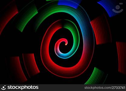 Abstract multicolored glowing in spiral pattern on black background.