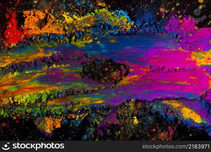 abstract multicolored holi powder explosion black background
