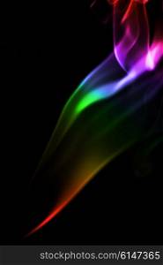 Abstract Multicolored smoke on a black background