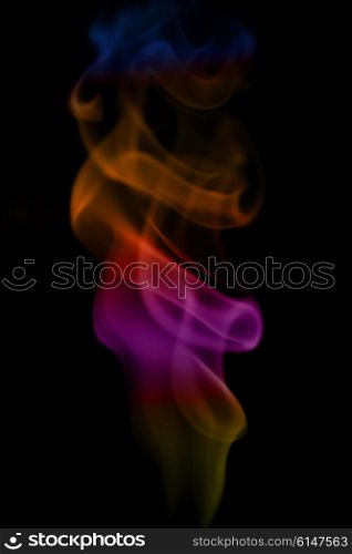 Abstract Multicolored smoke on a black background