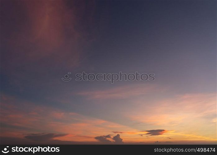 Abstract nature background. Dramatic blue sky with orange colorful sunset clouds in twilight time.